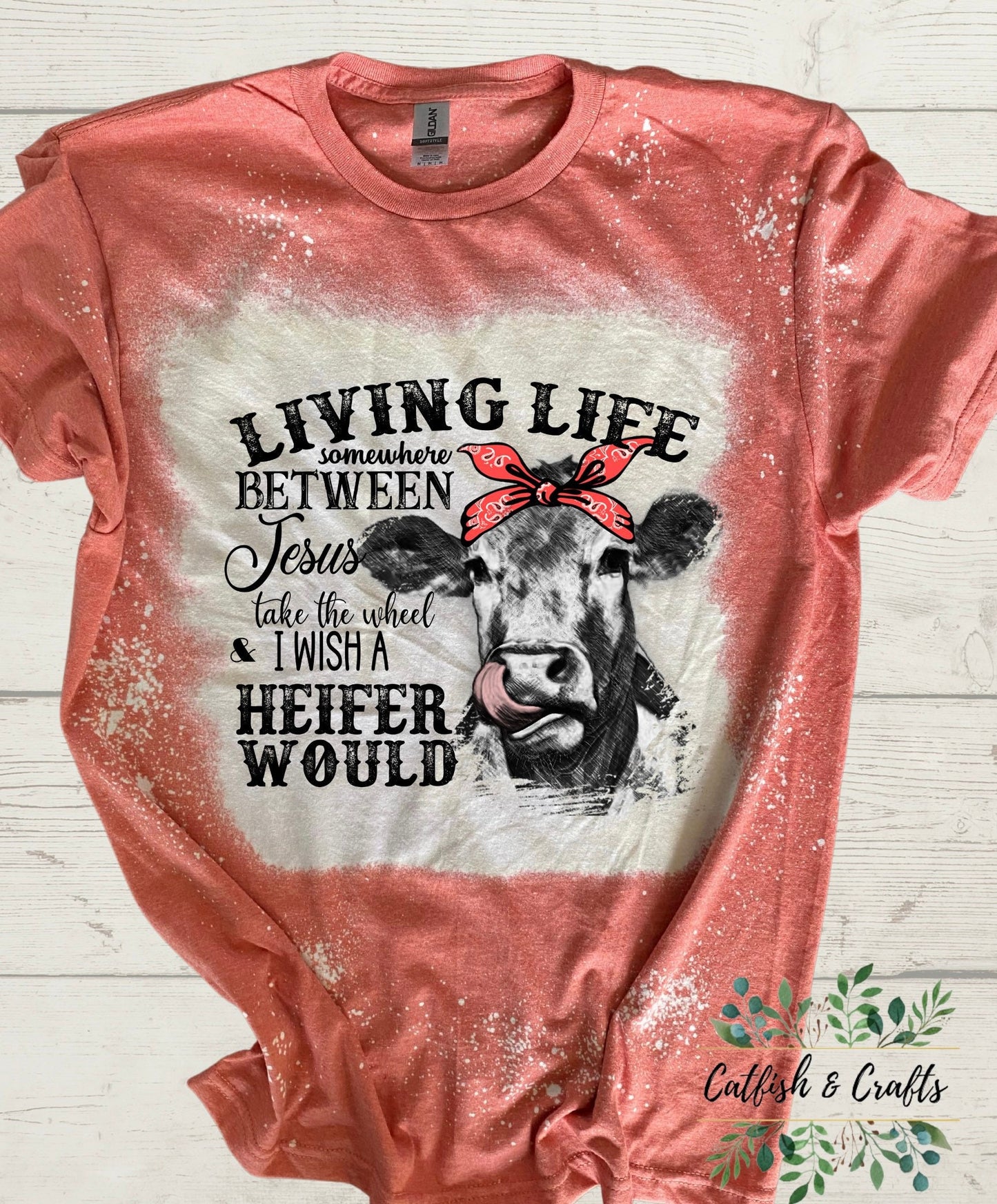 Lovin somewhere between Jesus take the wheel and I wish a heifer would bleached tee Funny